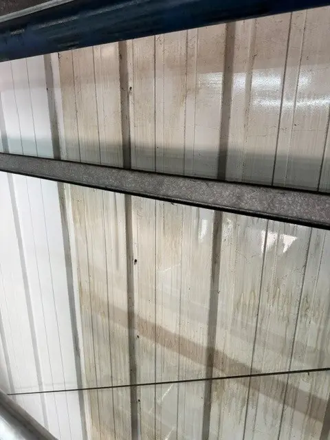 Soiled internal wall cladding before specialist cleaning