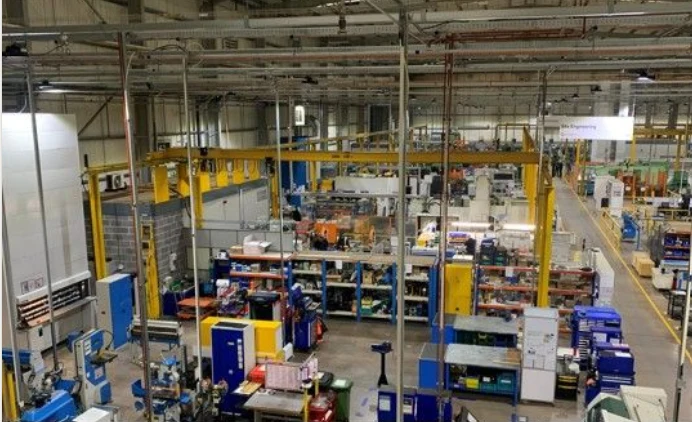 IMI Norgren's Fradley facility in use, with machinery, benching and overhead cranes across the production floor
