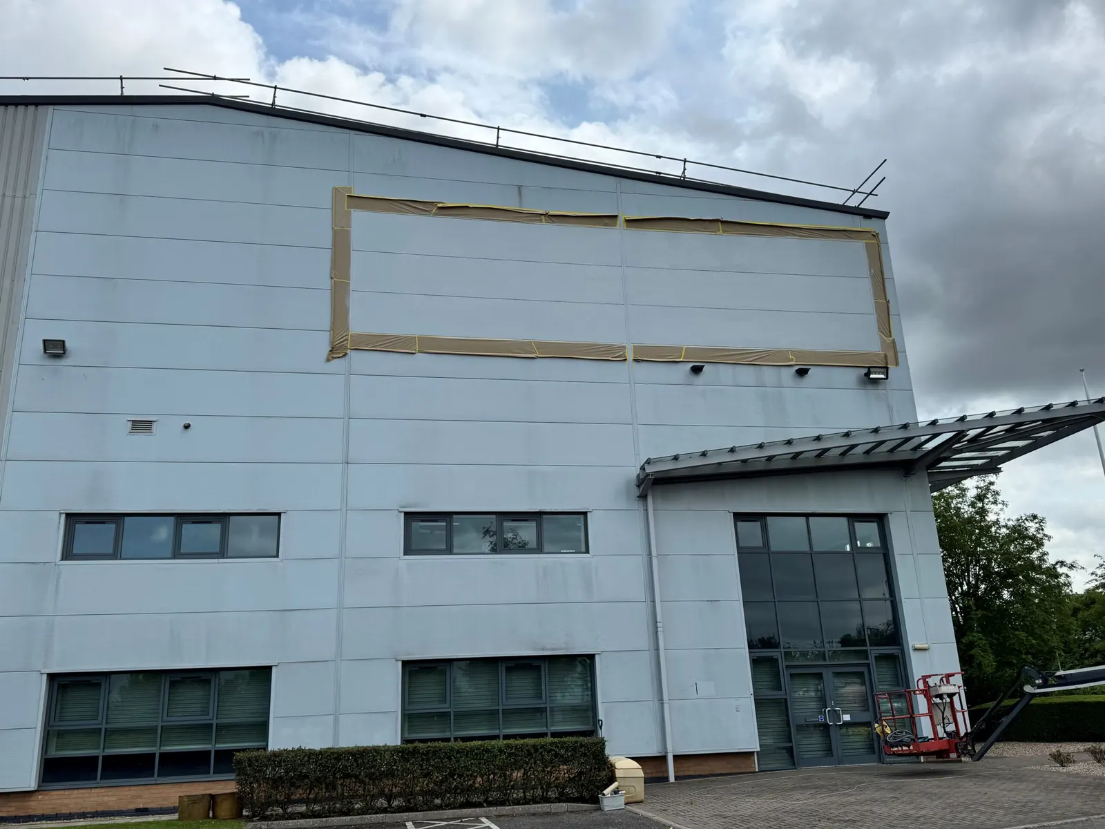 External elevation of the Fradley building with masking applied to the cladding